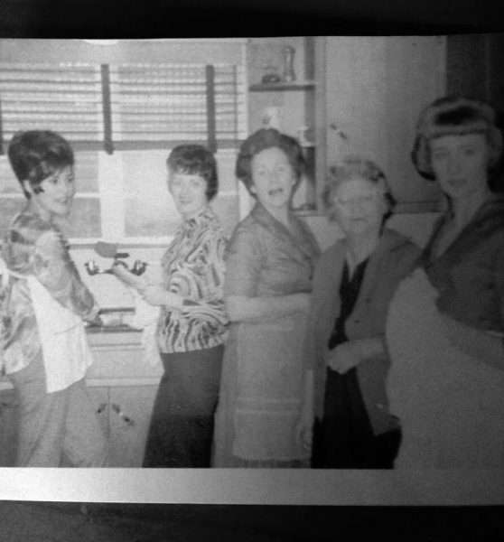 Black and white picture of her aunts, grandmother's and great grandmother in the kitchen