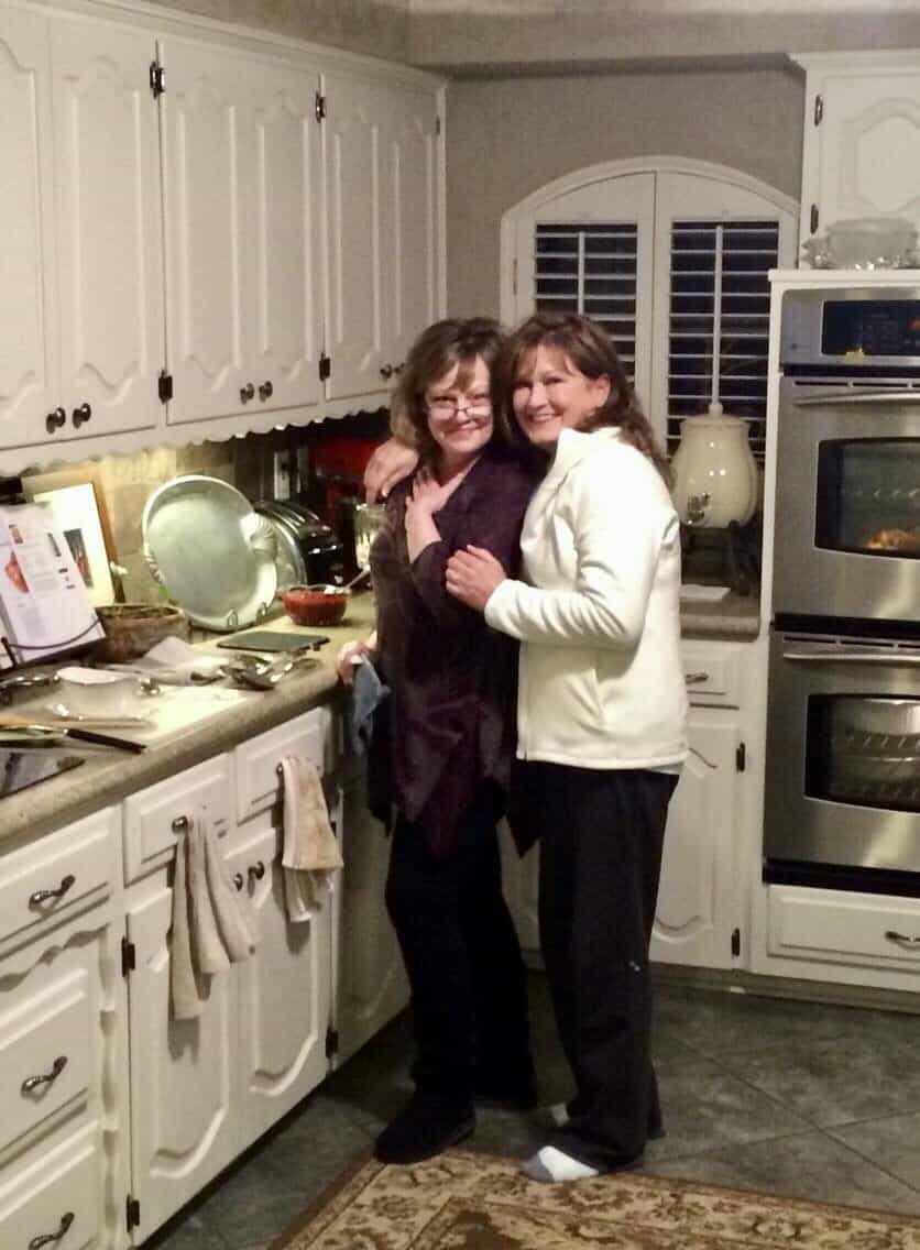 Anecia and Amy in kitchen cooking