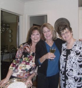 Anecia her mother and aunt in kitchen smiling