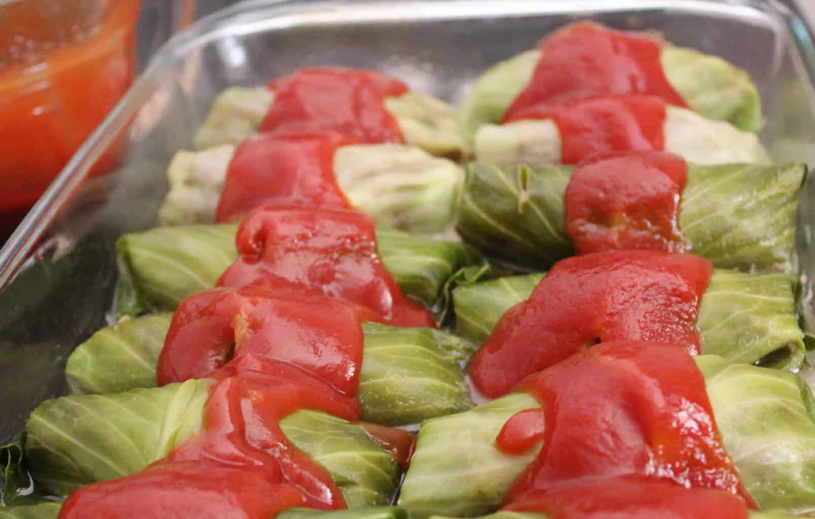 Cabbage rolls with tomato sauce in baking dish