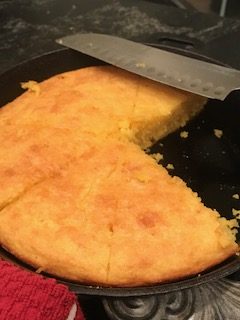Cornbread in skillet with knife