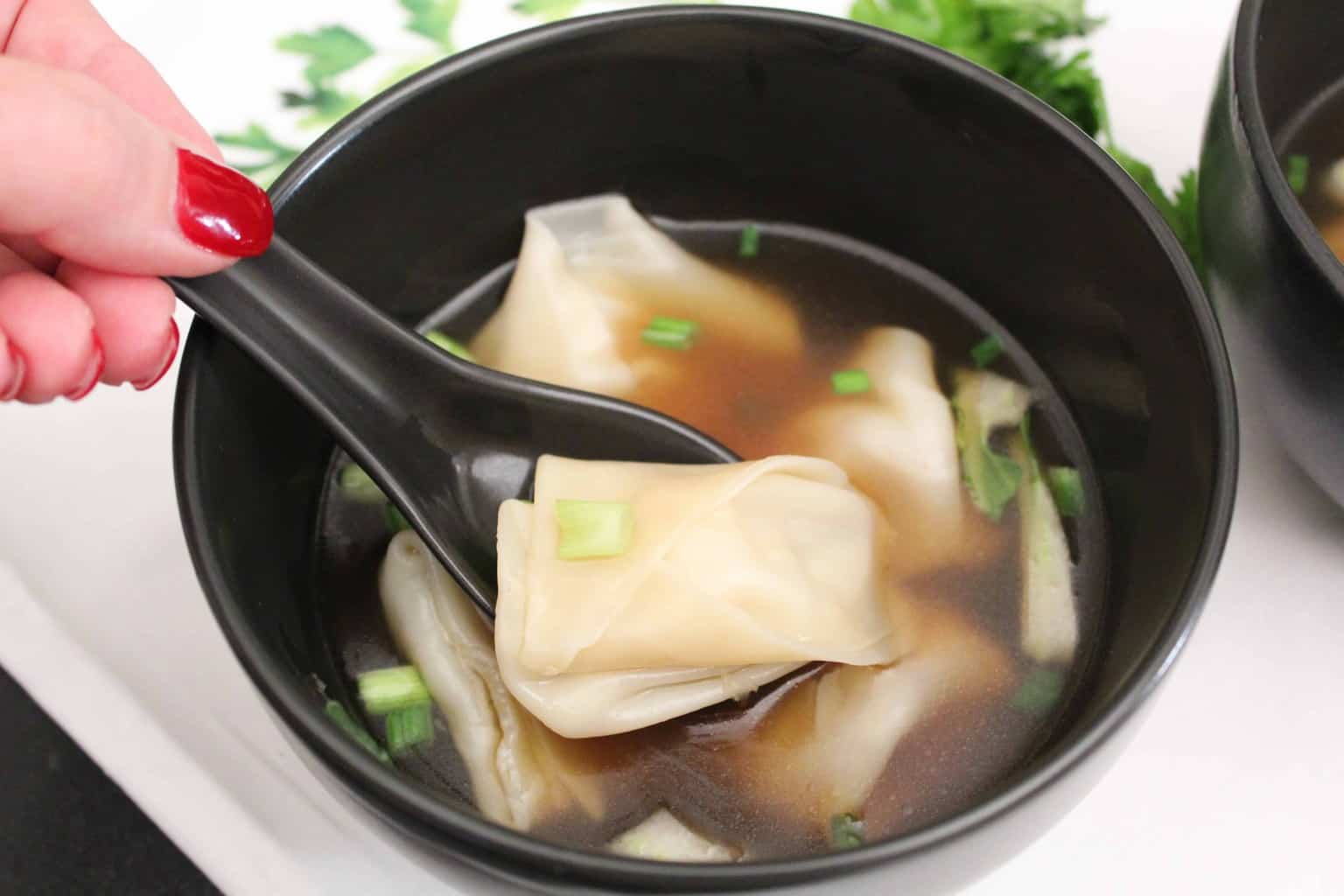 Won Ton Soup on a spoon.
