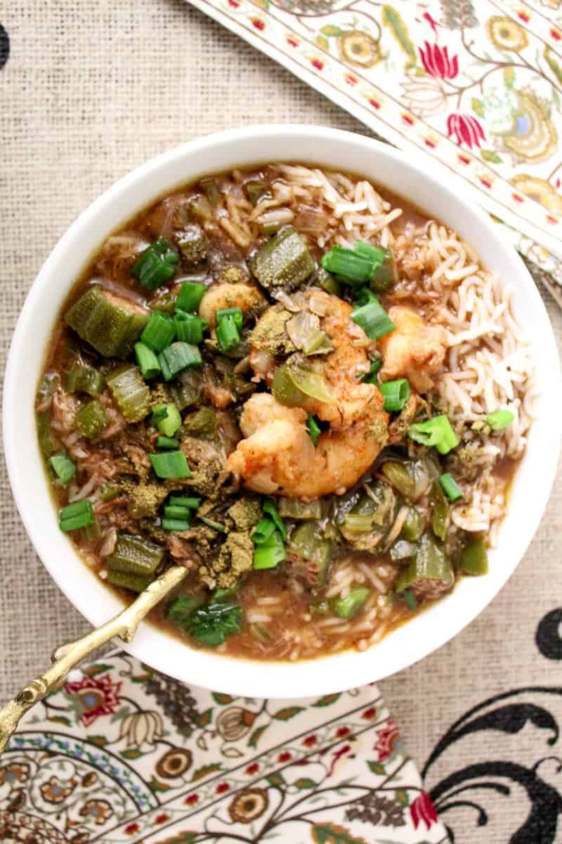 Bowl of Gumbo garnished with green onions.