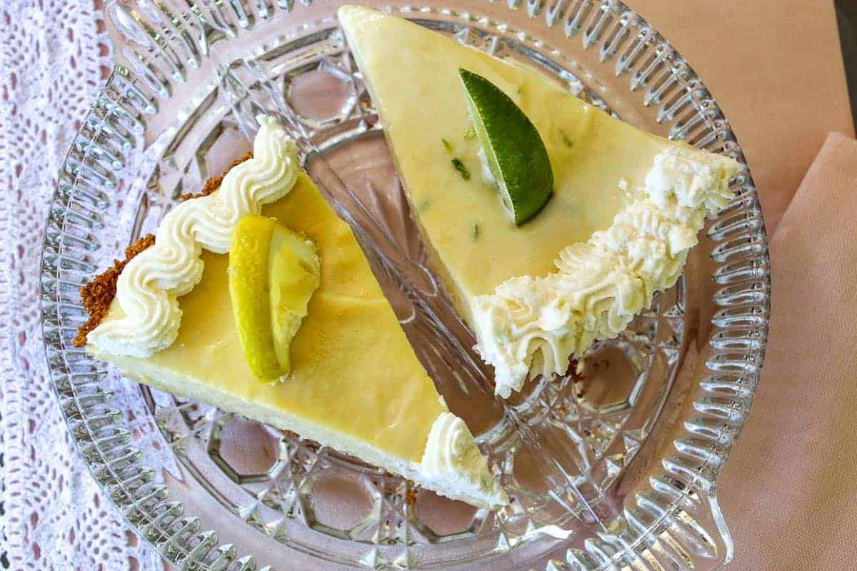 Lemon and Key Lime Icebox Pie slices on a glass plate