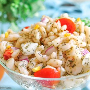 Orange Shrimp and scallop ceviche in glass bowl