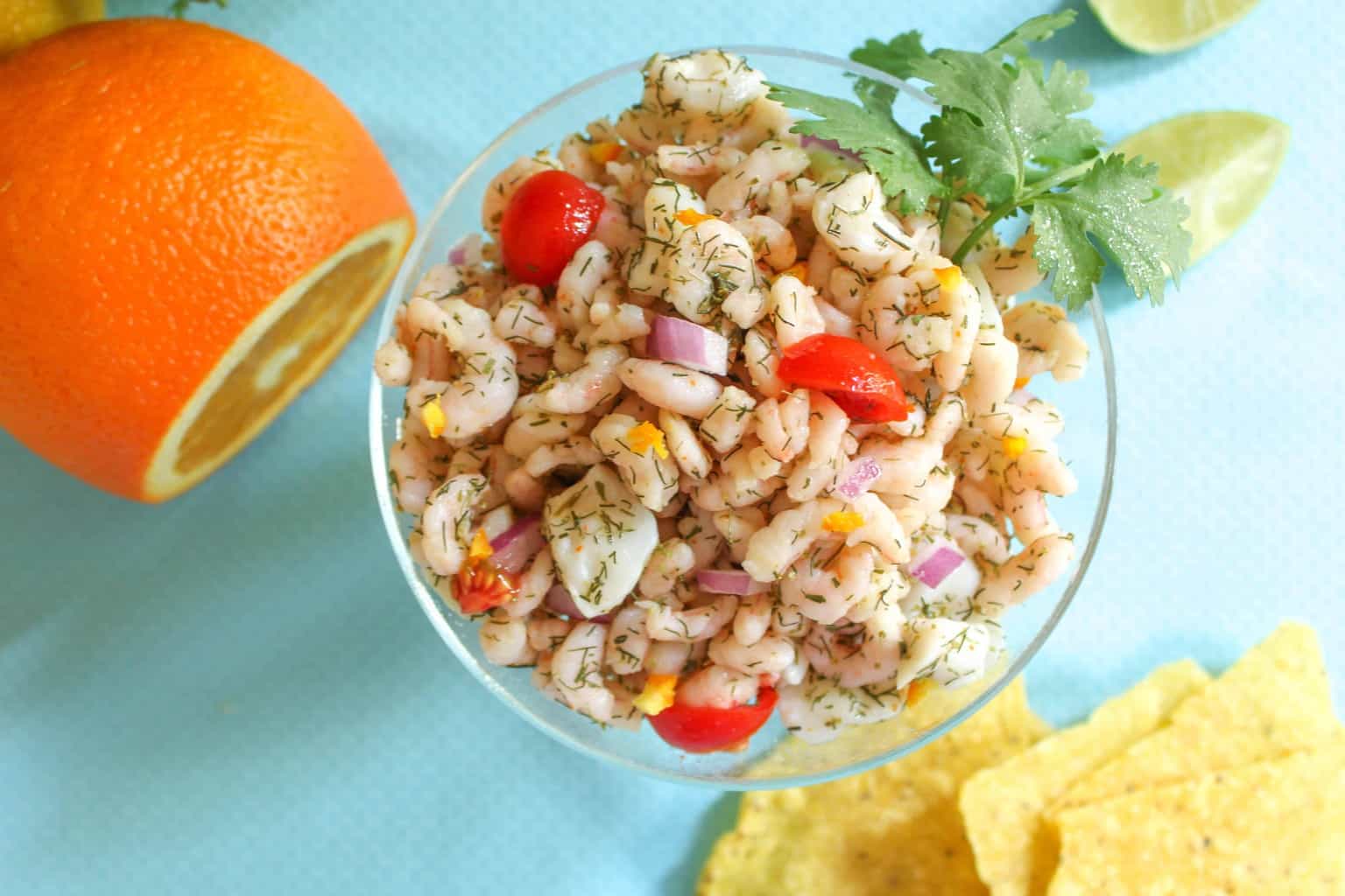 Orange shrimp and scallop Ceviche in a glass bowl