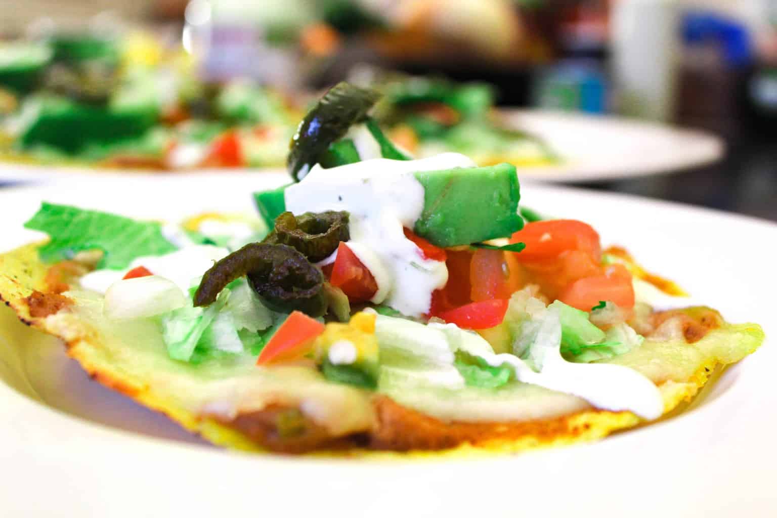 Tostada on white plate.