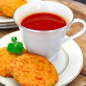 Tomato drink in china cup on saucer.