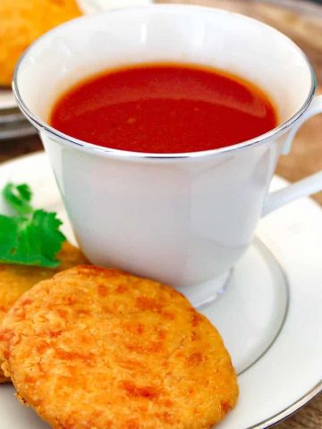 Tomato drink in china cup on saucer.