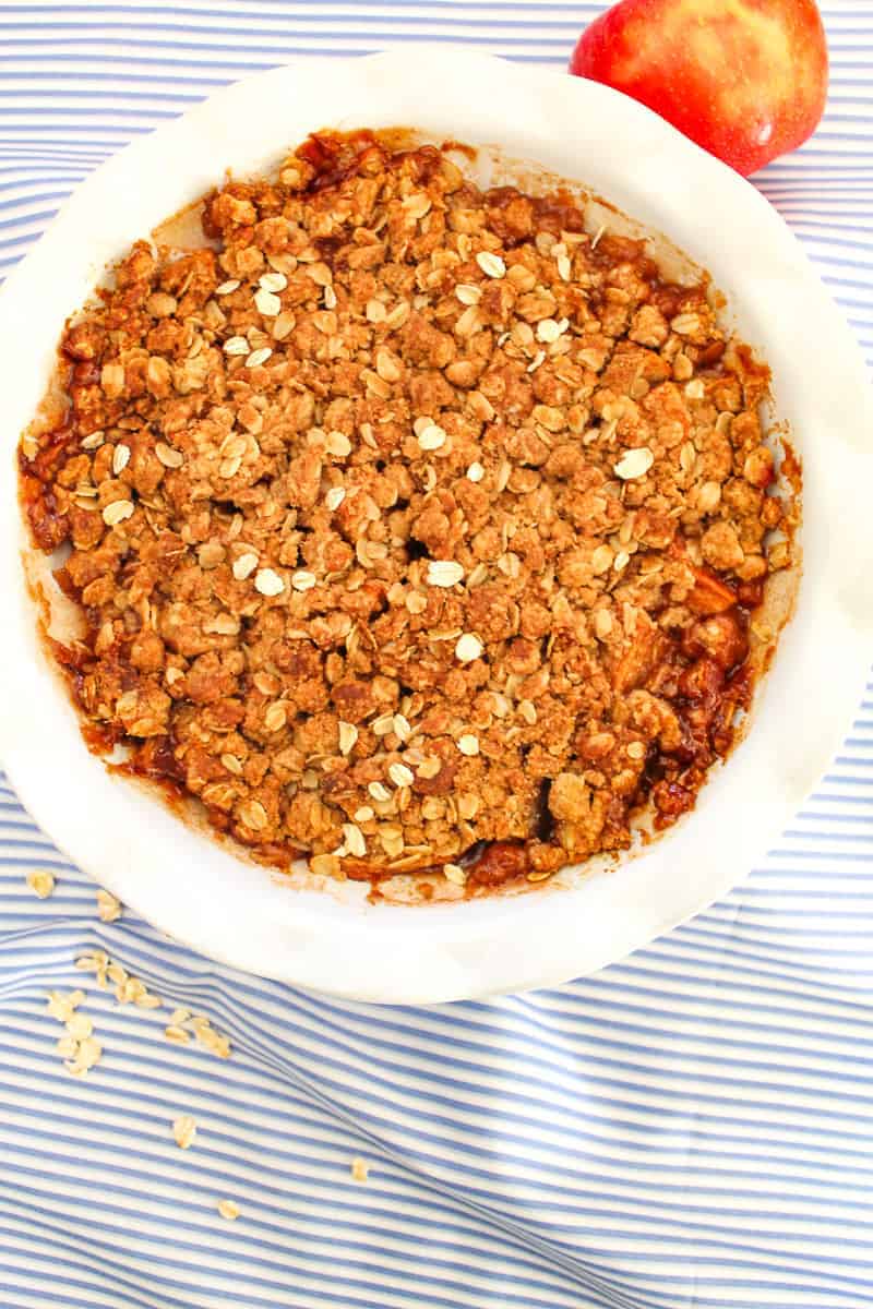 Apple Crisp Apple Crumb in a white scalloped baking dish.