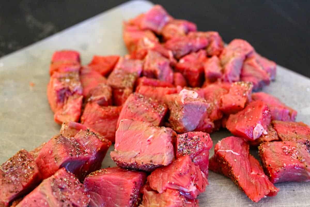 Cubed sirloin for beef stew on cutting board