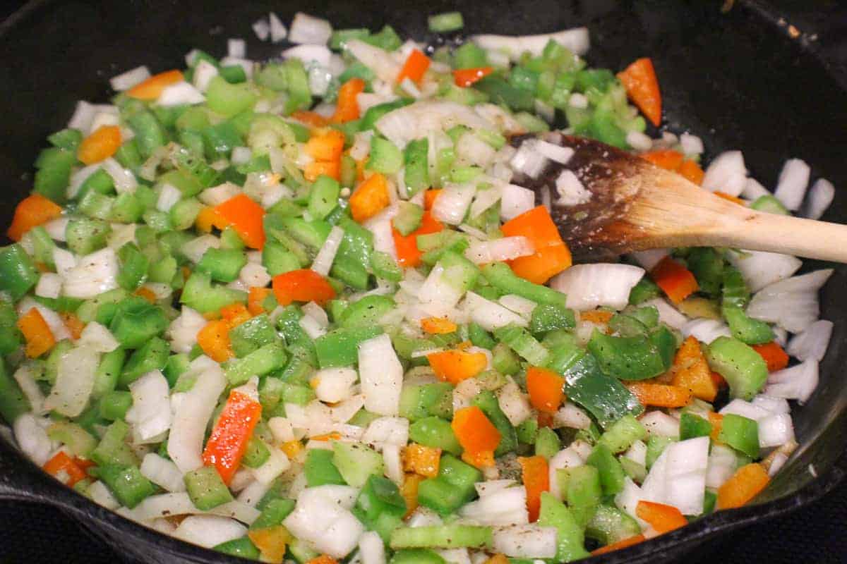 Saute peppers and onions as a base for chicken spaghetti