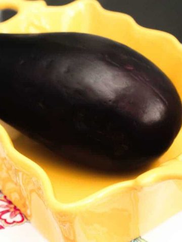 Wjp;e Eggplant in a yellow rectangular baking dish