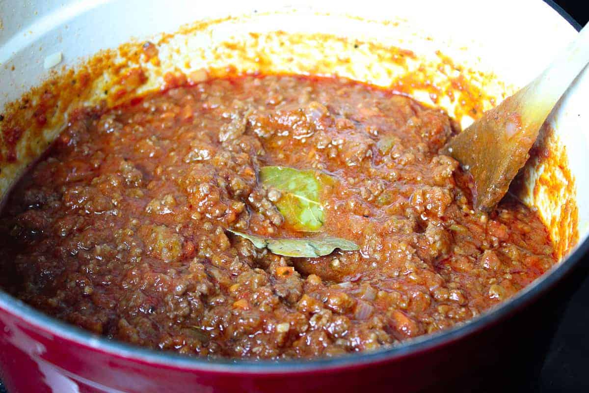 Bay leaves in sauce in stockpot