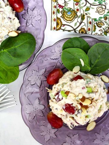 Turkey salad on purple plate.