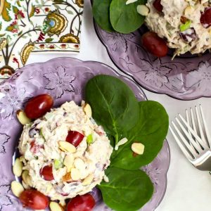 Turkey salad on purple plate.