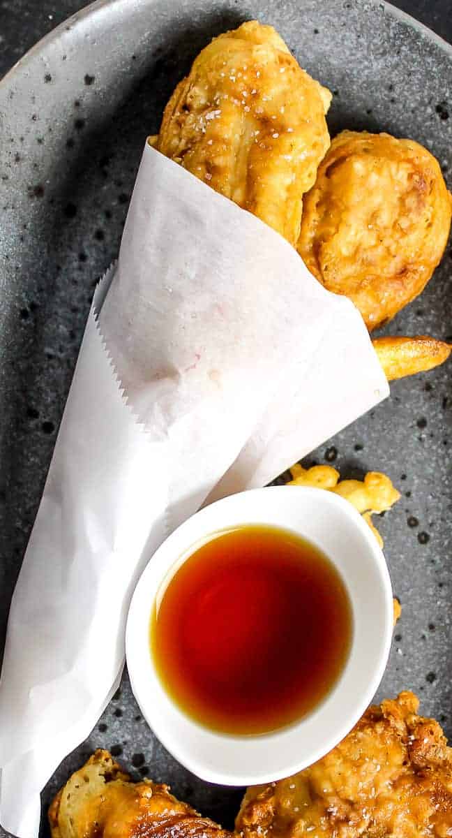 fried fish in white paper.