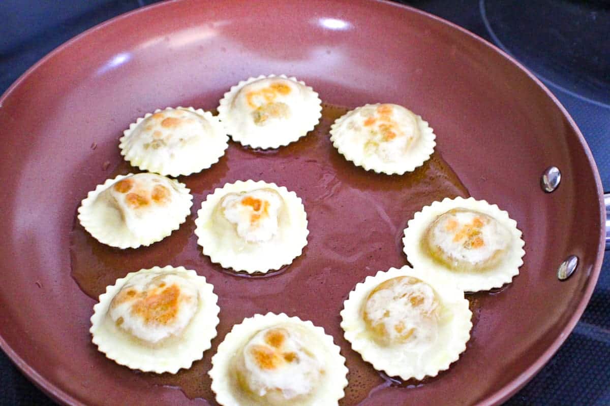 Ravioli in skillet.
