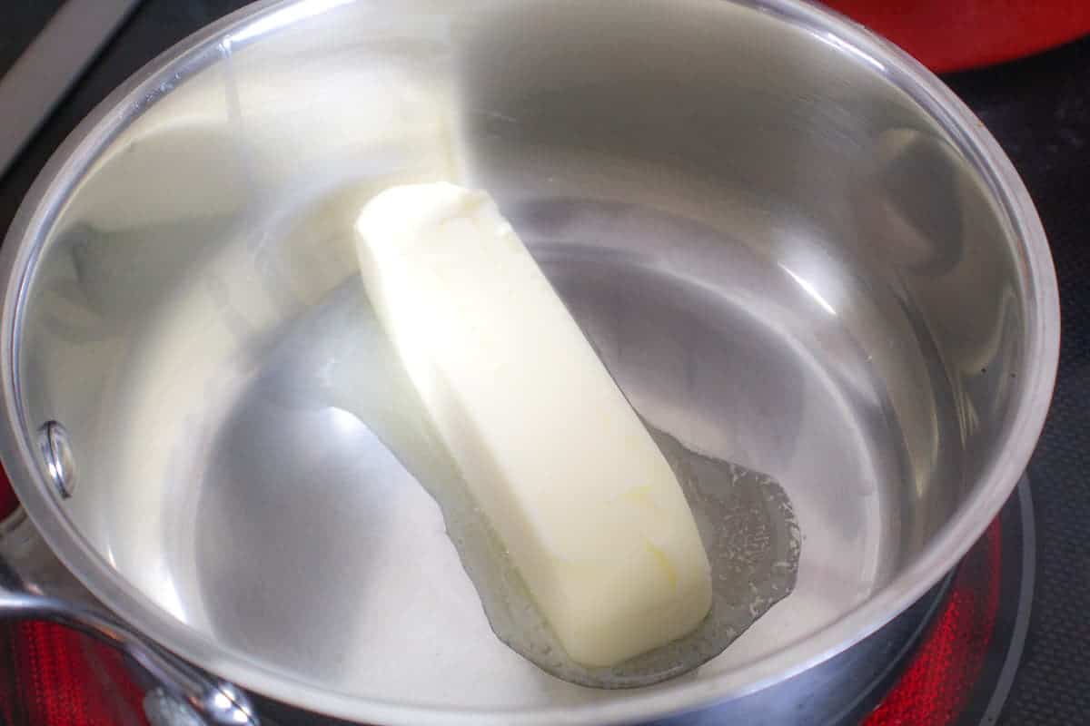 Stick of butter melting in pan