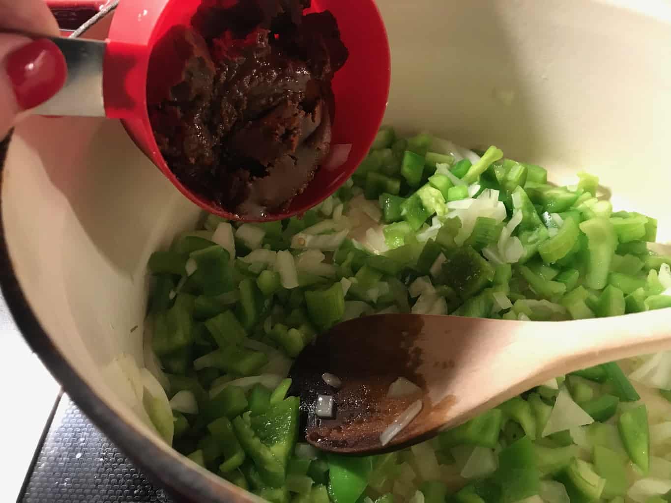 Roux being added to stockpot.