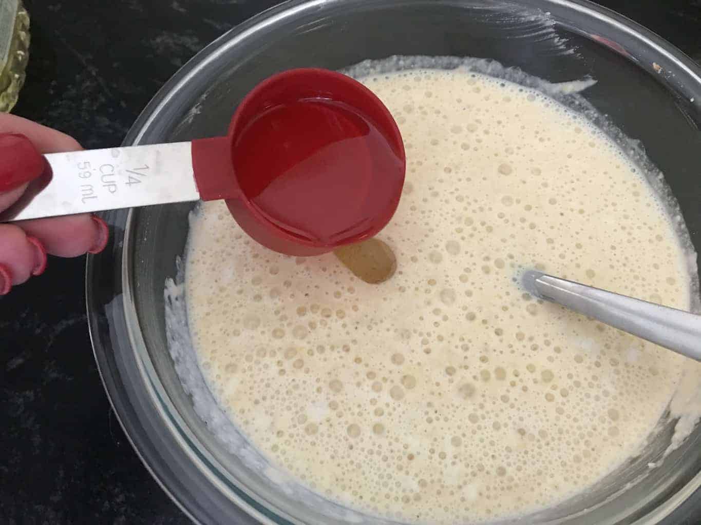 Oil being poured into batter.