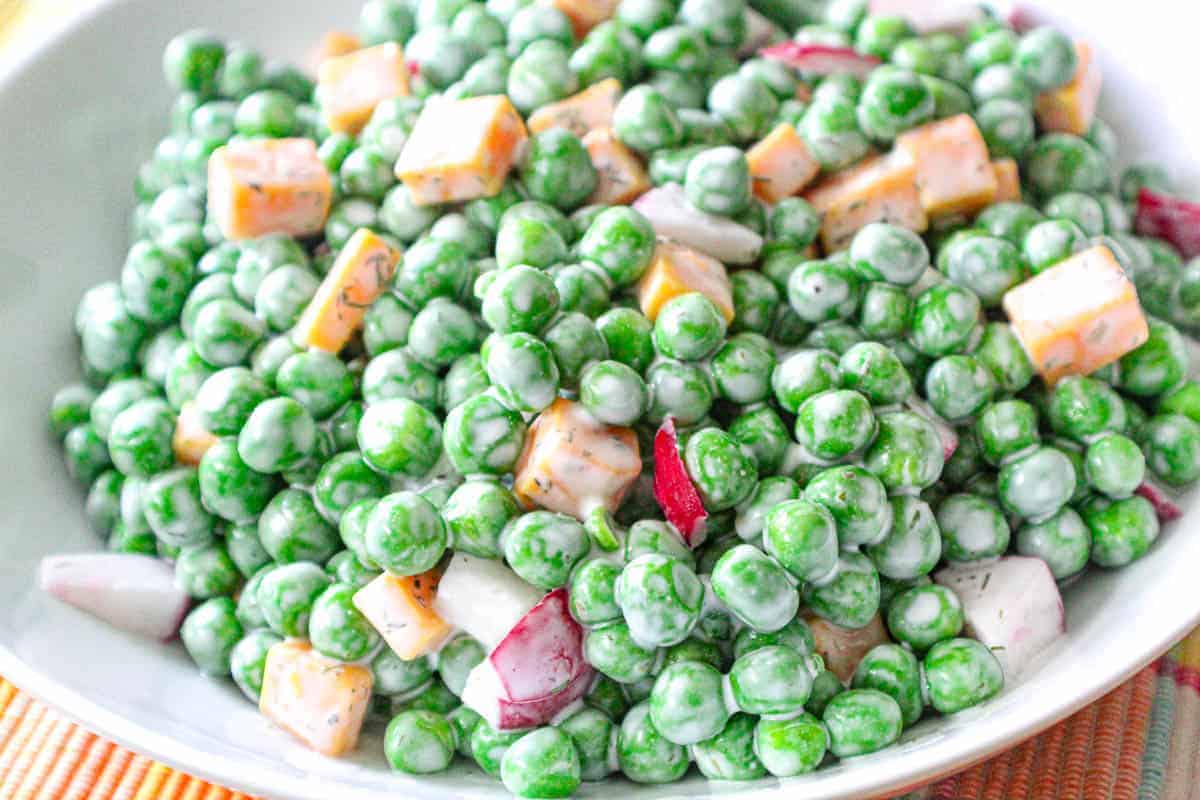 Close up of English Pea Salad in white bowl