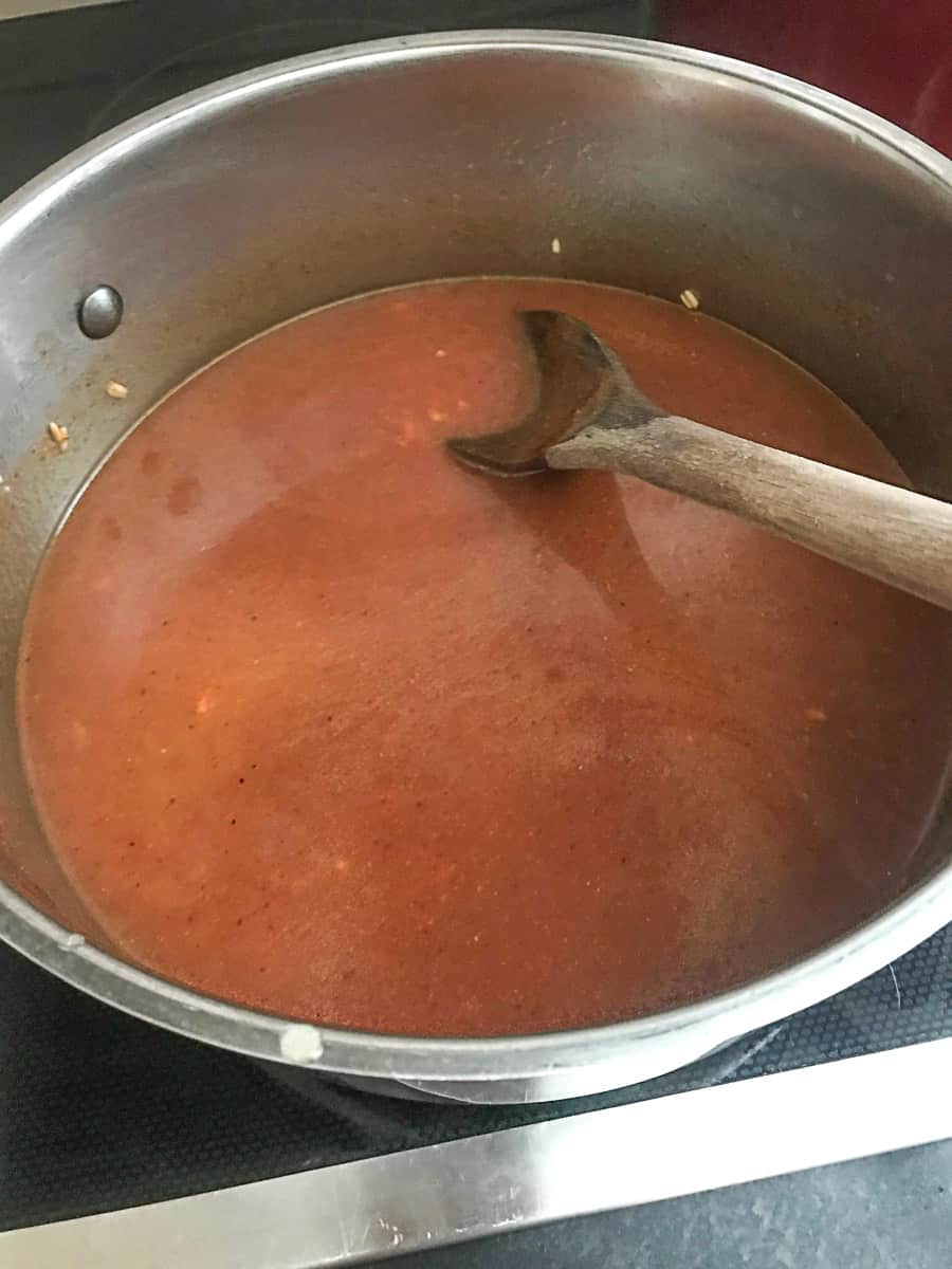Tomato sauce added to stockpot