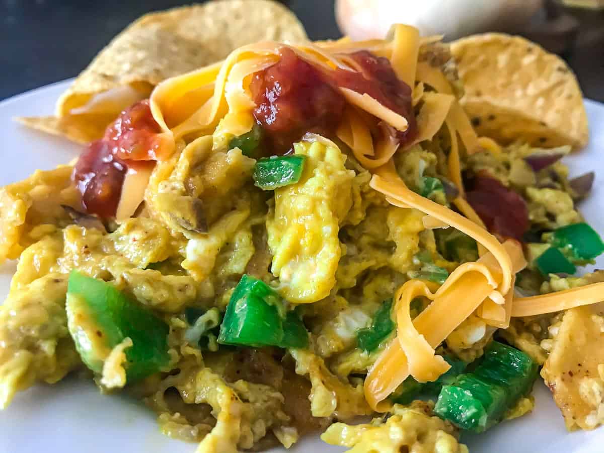 Tex Mex Migas topped with cheese and salsa.