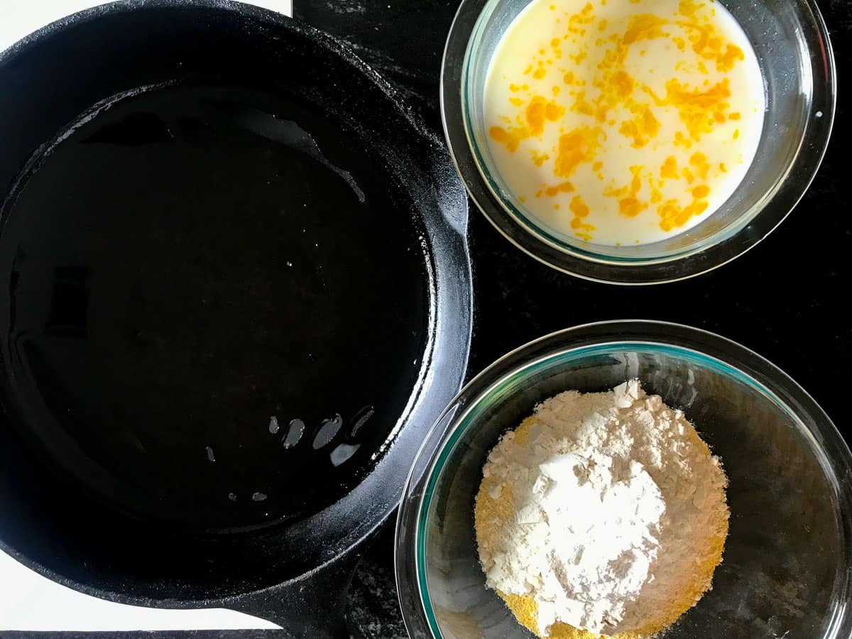 Two bowls one with wet and one with dry ingredients.