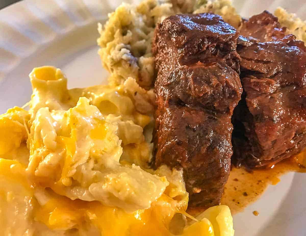 Country ribs and macaroni and cheese on white plate