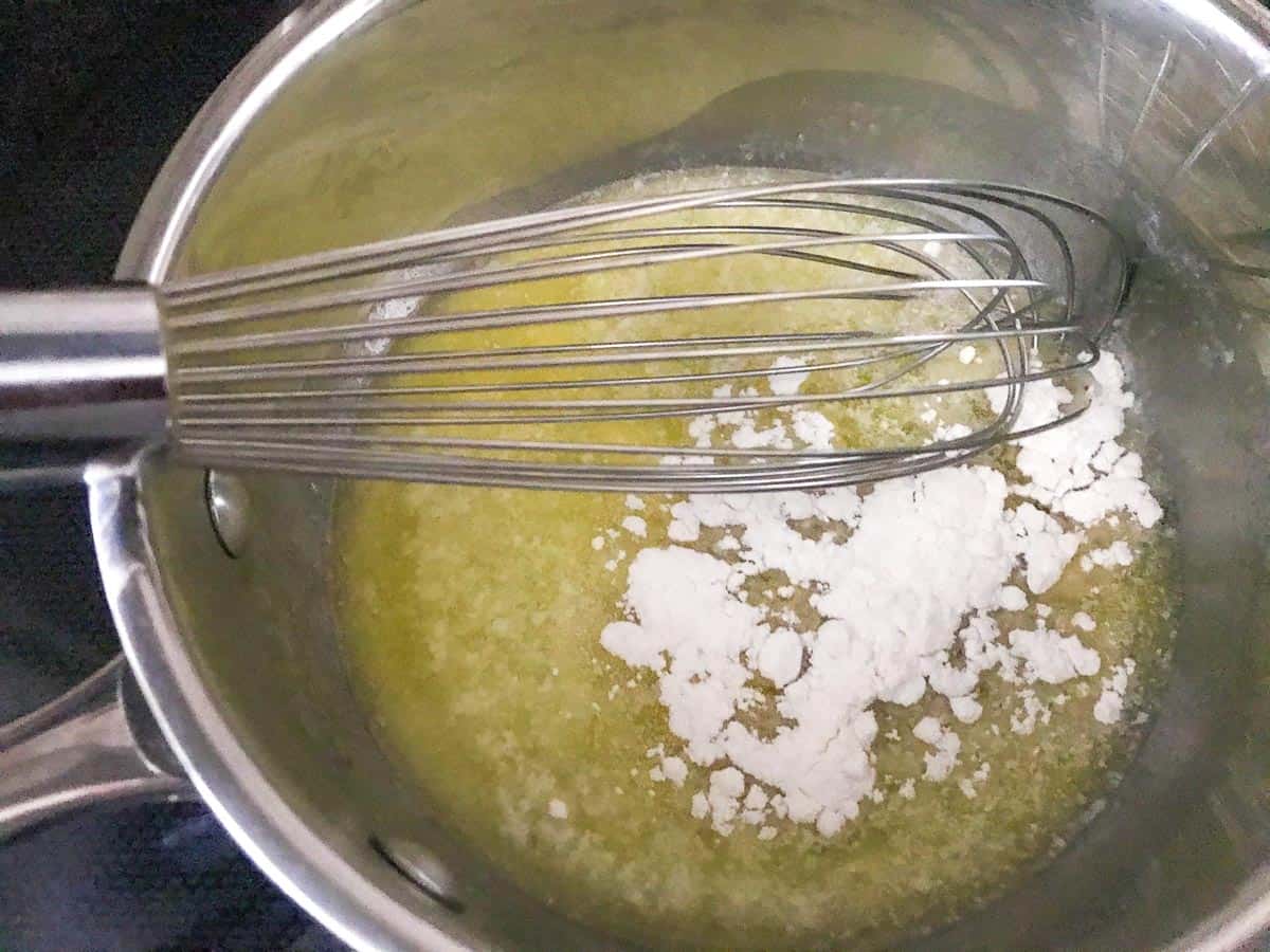 Flour being whisked into melted butter