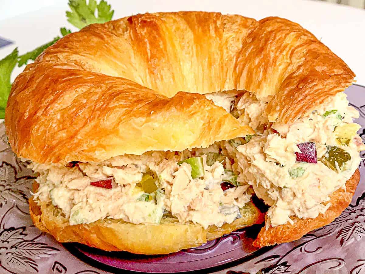 Southern Tuna Salad on croissant on a purple plate