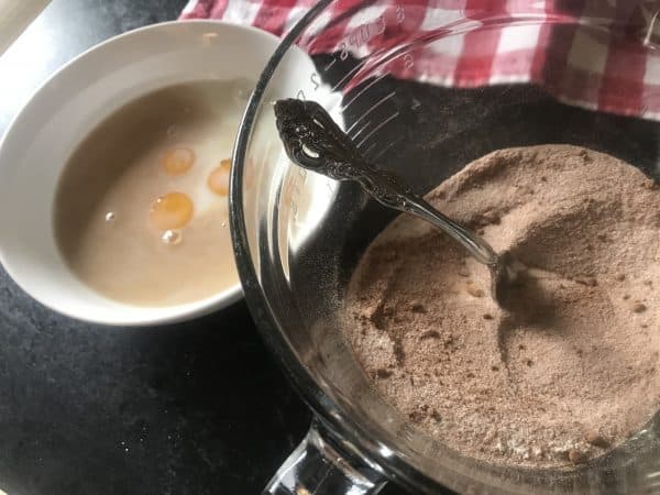 Two bowls: one with wet and one with dry ingredients