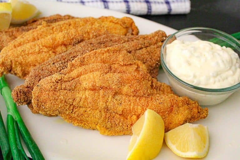 Fried catfish filets with tartar sauce.