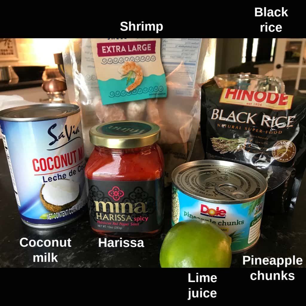 Ingredients for harissa shrimp labeled on counter