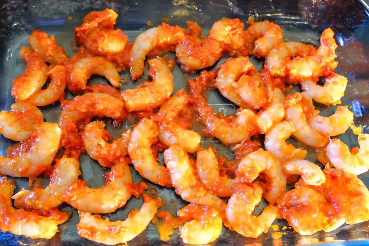 Shrimp coated with Harissa in baking dish