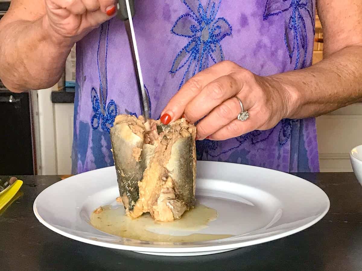 Knife inserted into tuna