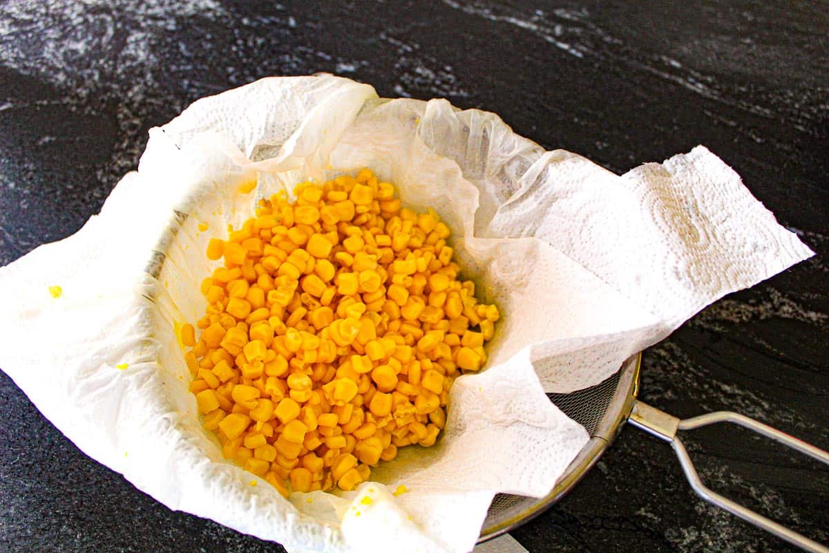 Drain frozen or fresh corn in colander