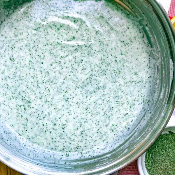 Herb dill cream sauce in skillet