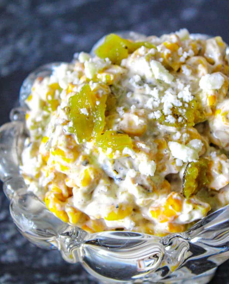 Roasted corn and green chile dip in glass bowl