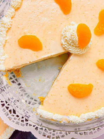 Orange Creamsicle Pie garnished with whipped cream edging and mandarin oranges