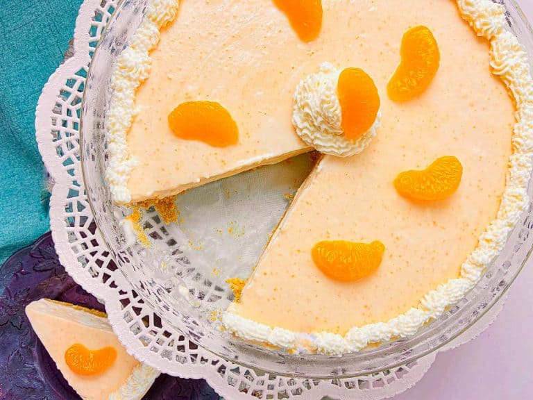 Orange Creamsicle Pie garnished with whipped cream edging and mandarin oranges