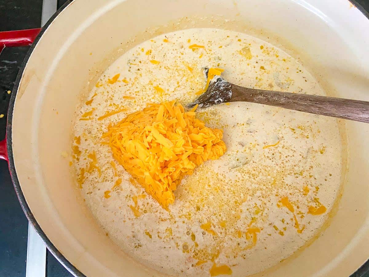 Shredded cheese added to soup