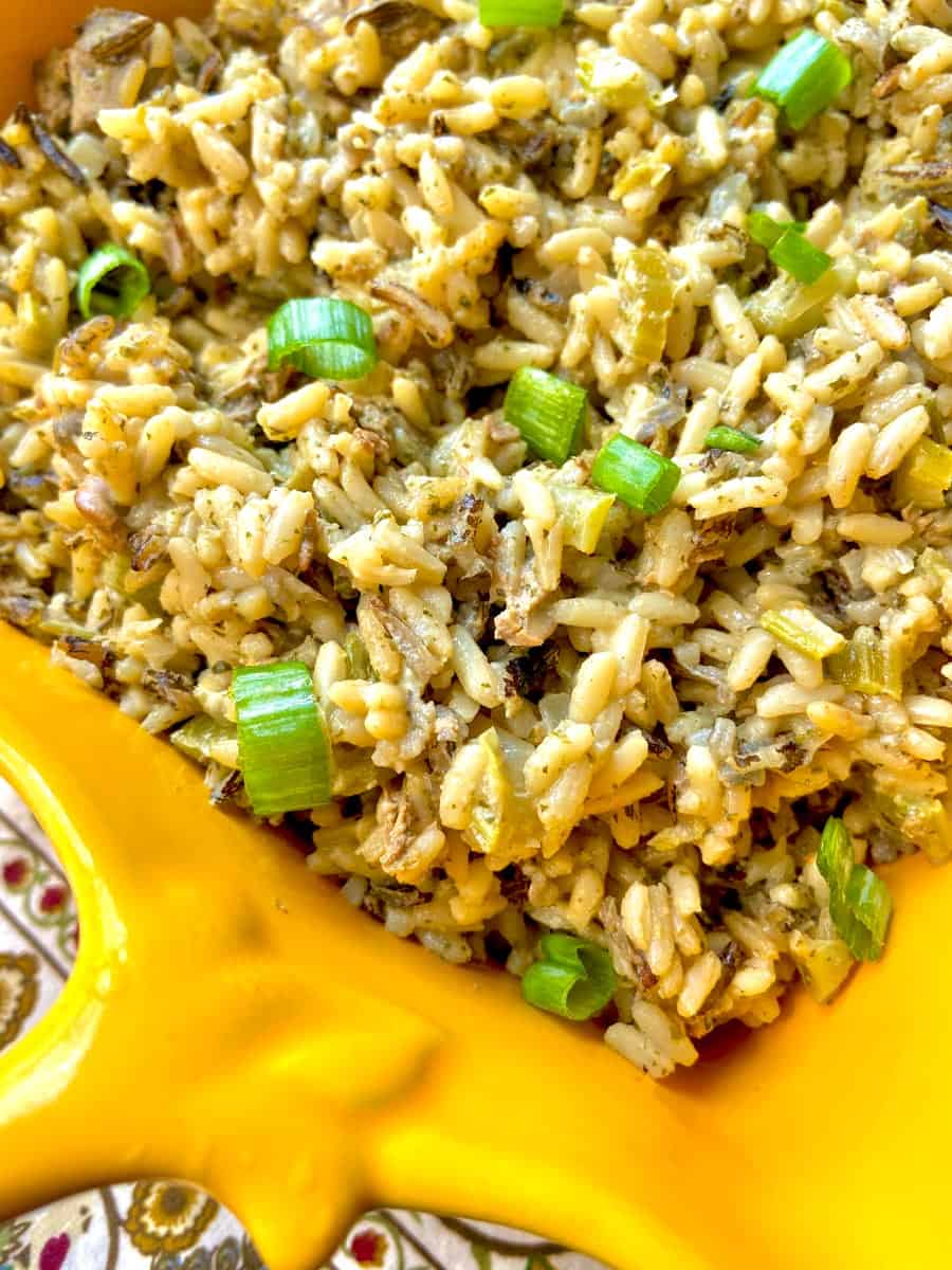 Wild Rice and Oyster Dressing in a yellow serving dish.