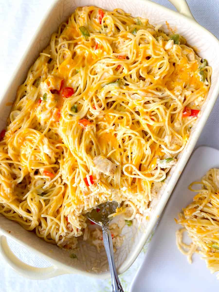 Chicken spaghetti casserole in baking dish.