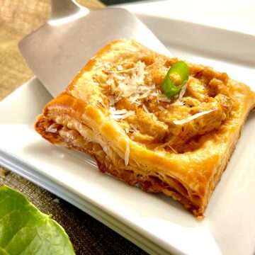 Crab Puff being served onto small white plate