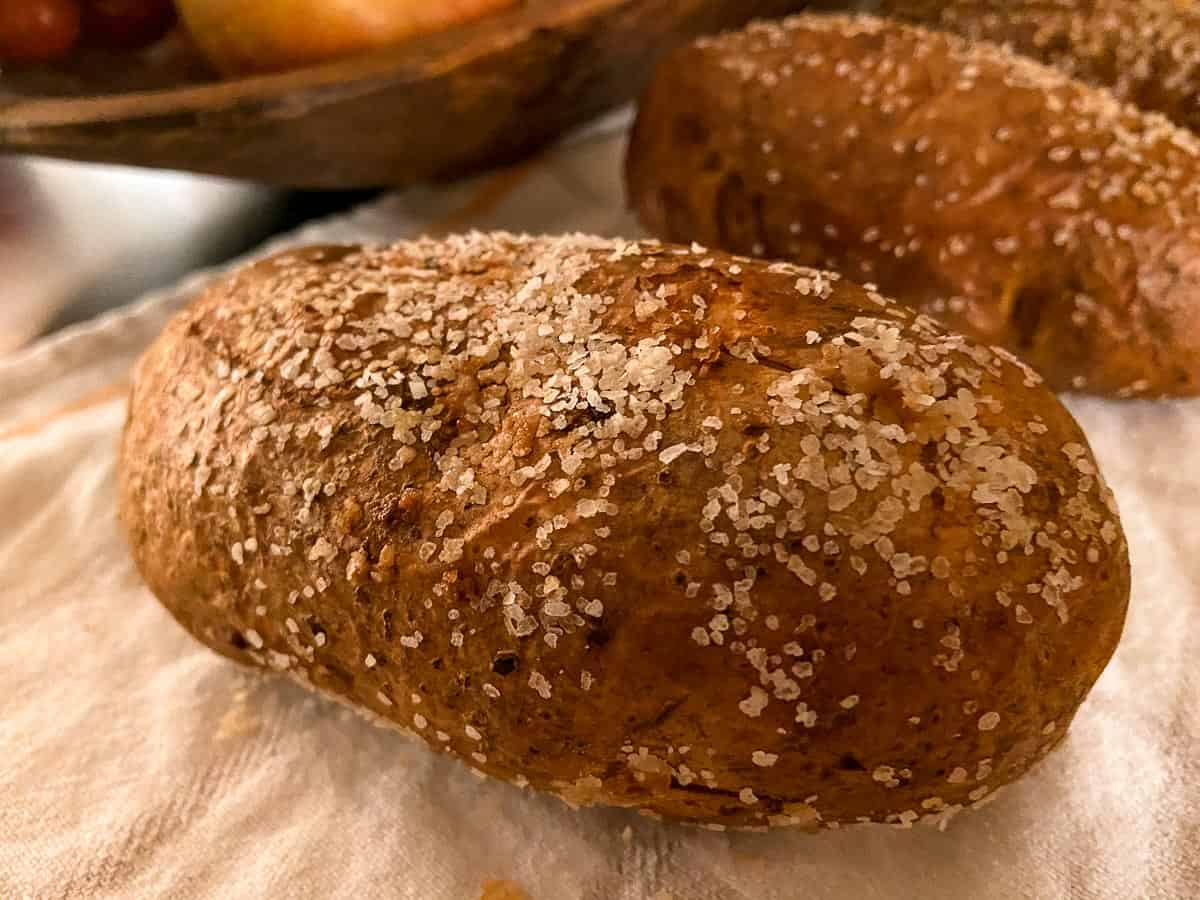 Salted baked potato on counter