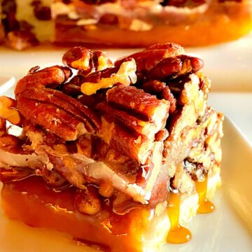 Square cut of Texas Pecan bar on a white plate