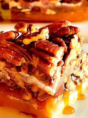 Square cut of Texas Pecan bar on a white plate