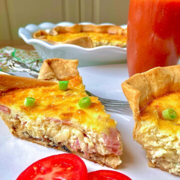 Two slices of quiche on white plate.